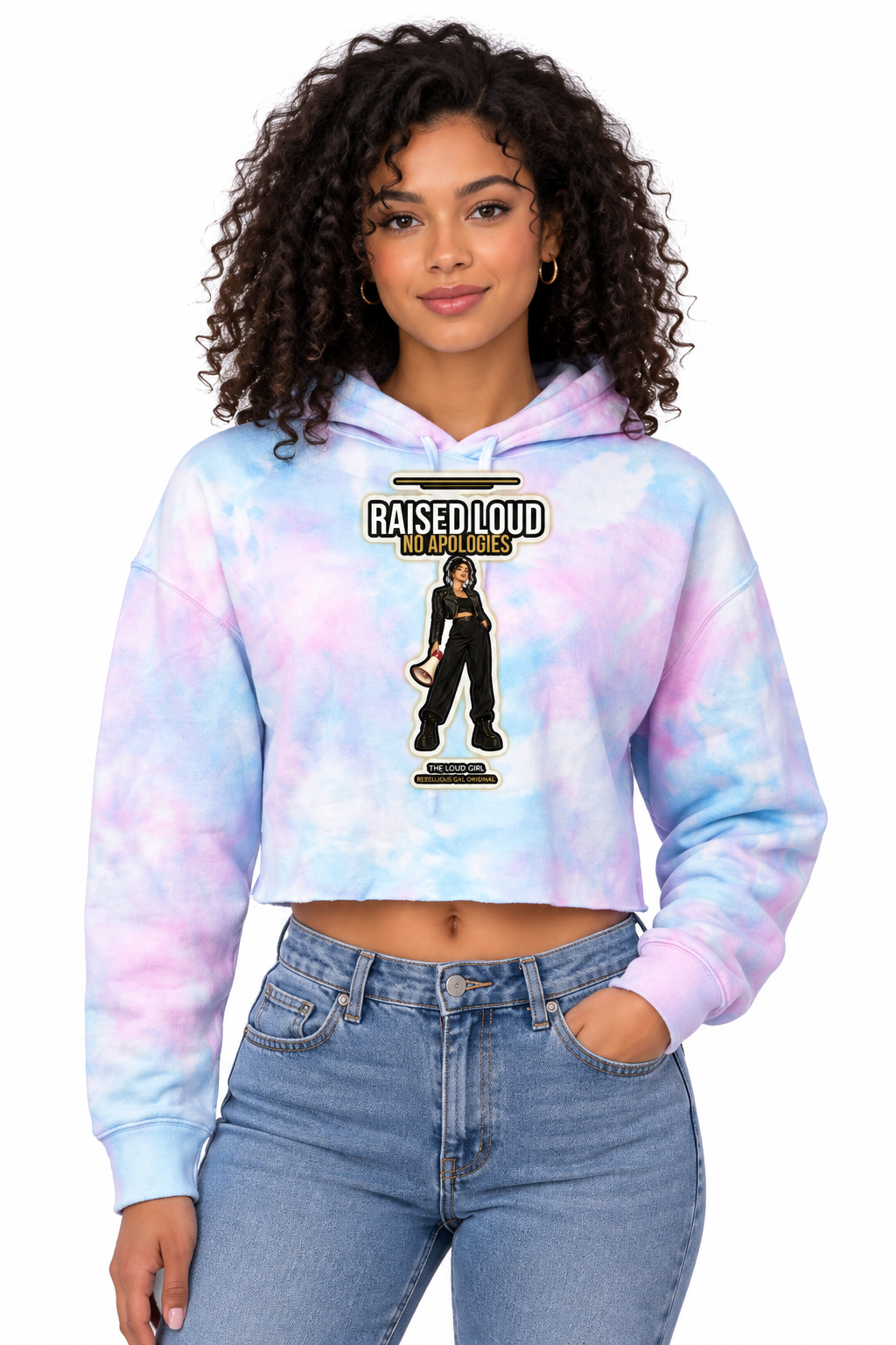 Curly-haired woman in the cotton candy tie dye crop hoodie with the Raised Loud No Apologies print