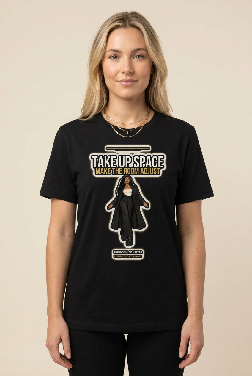 Blonde woman with gold necklaces in the black Room Adjuster crew tee, beige backdrop