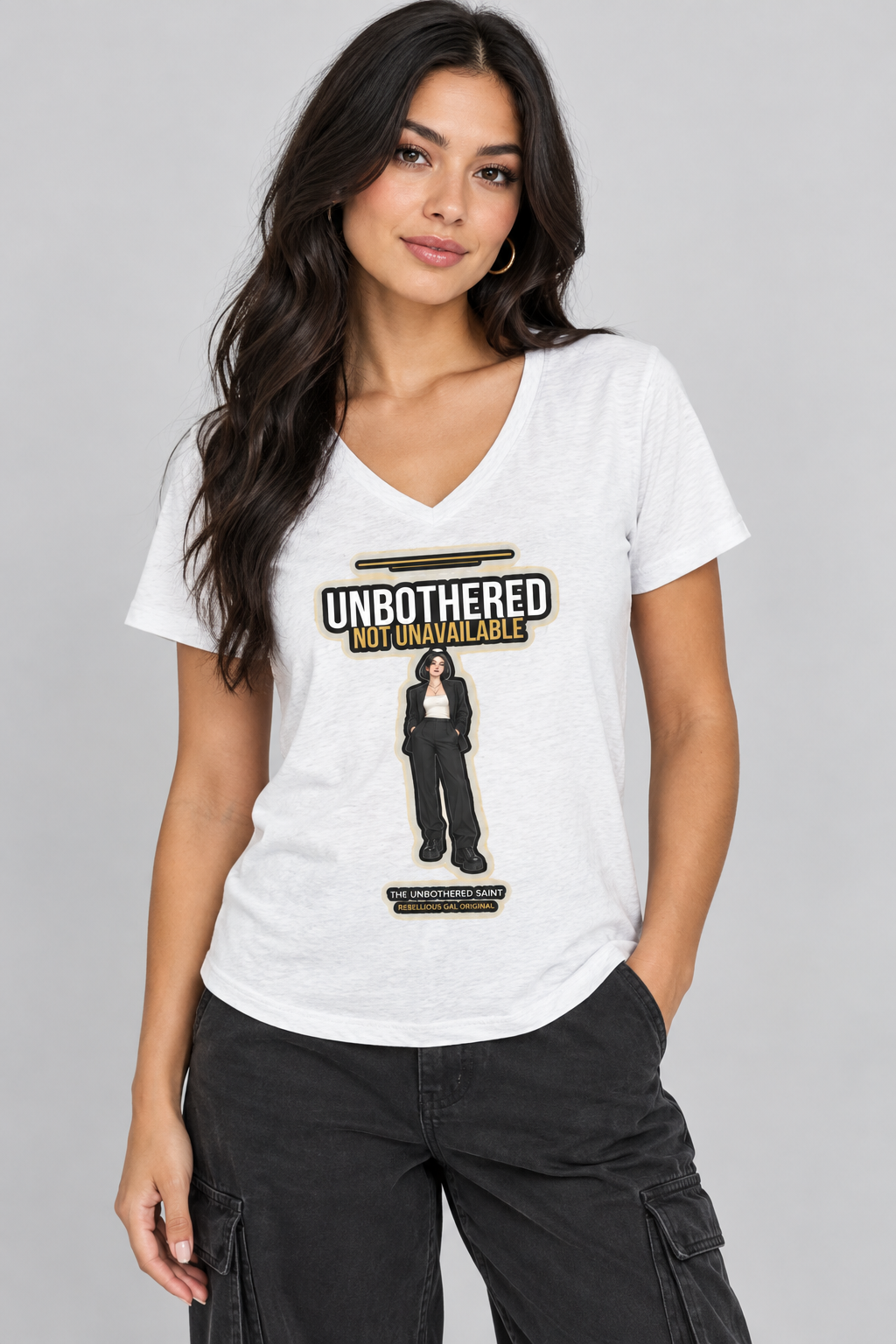 Woman with long dark hair in the white Unbothered Saint v-neck tee, grey studio