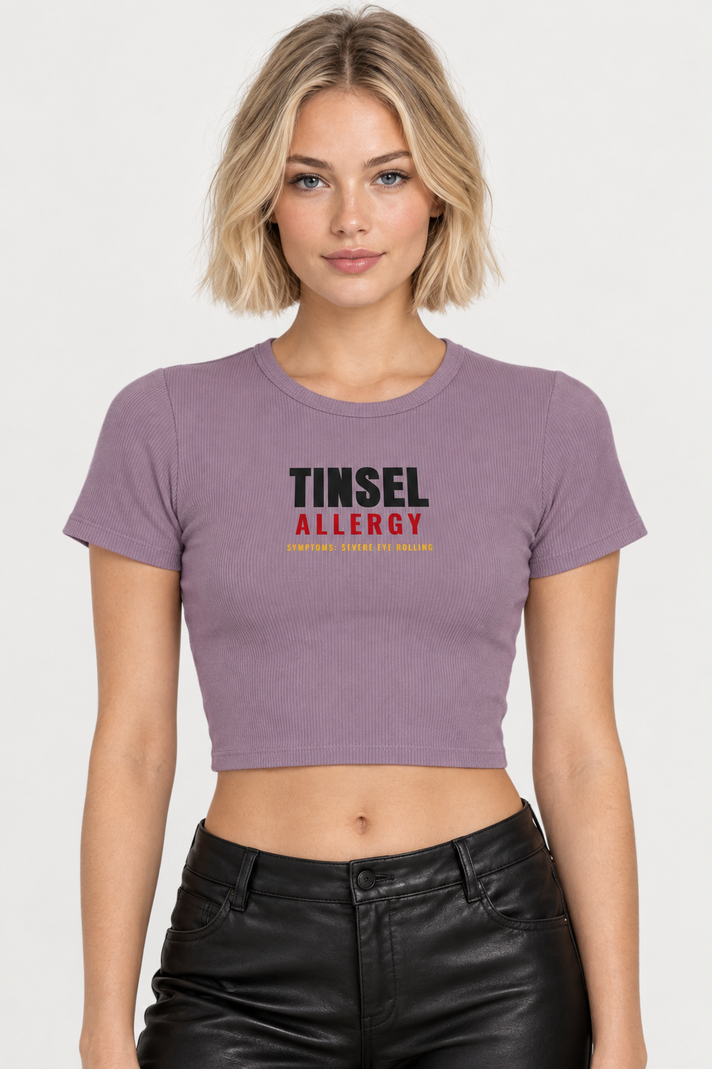 Woman with a blonde bob in the smokey violet Tinsel Allergy crop tee, pale backdrop